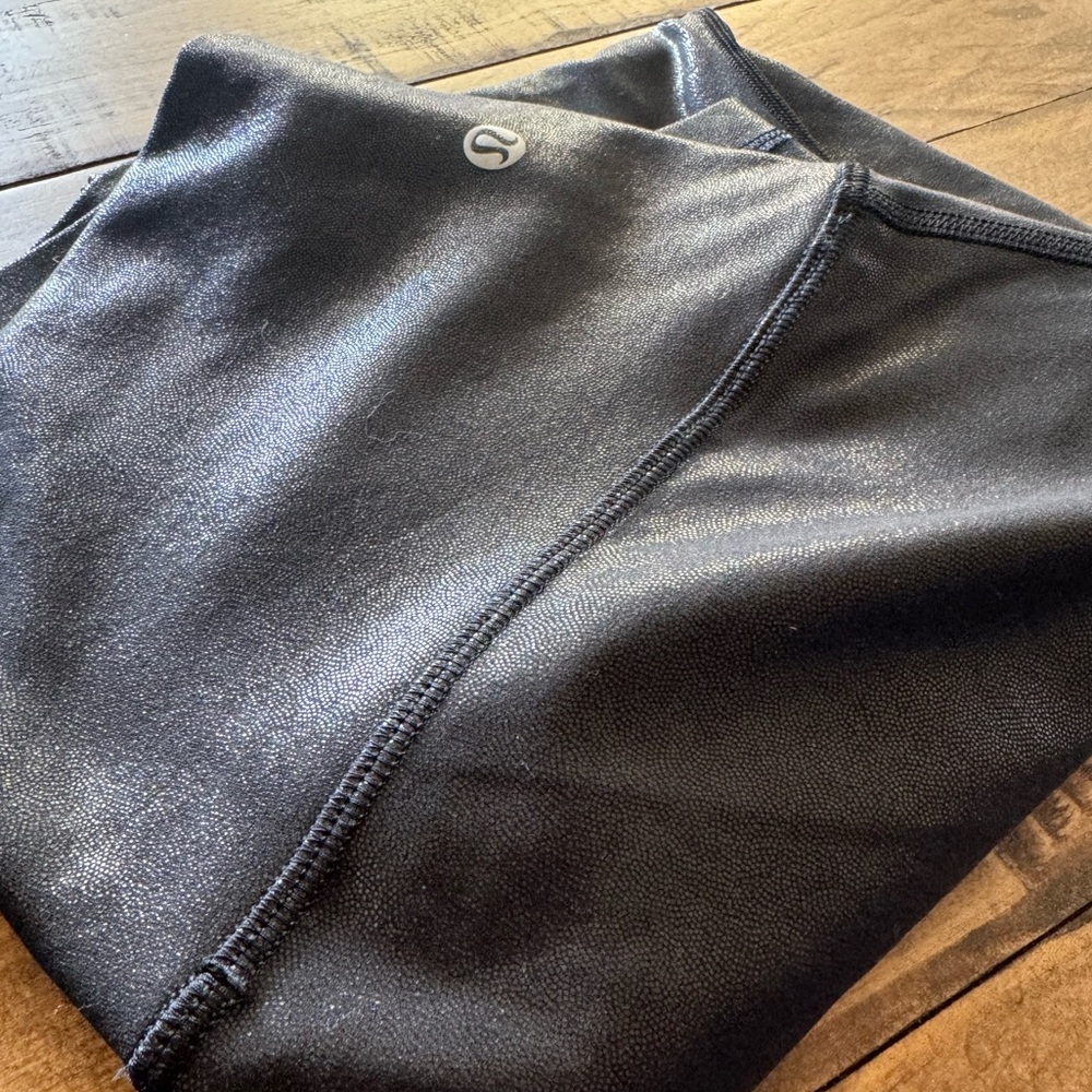 Lululemon Align High Rise pant, color is black “radiant foil.” Size 8. 25”